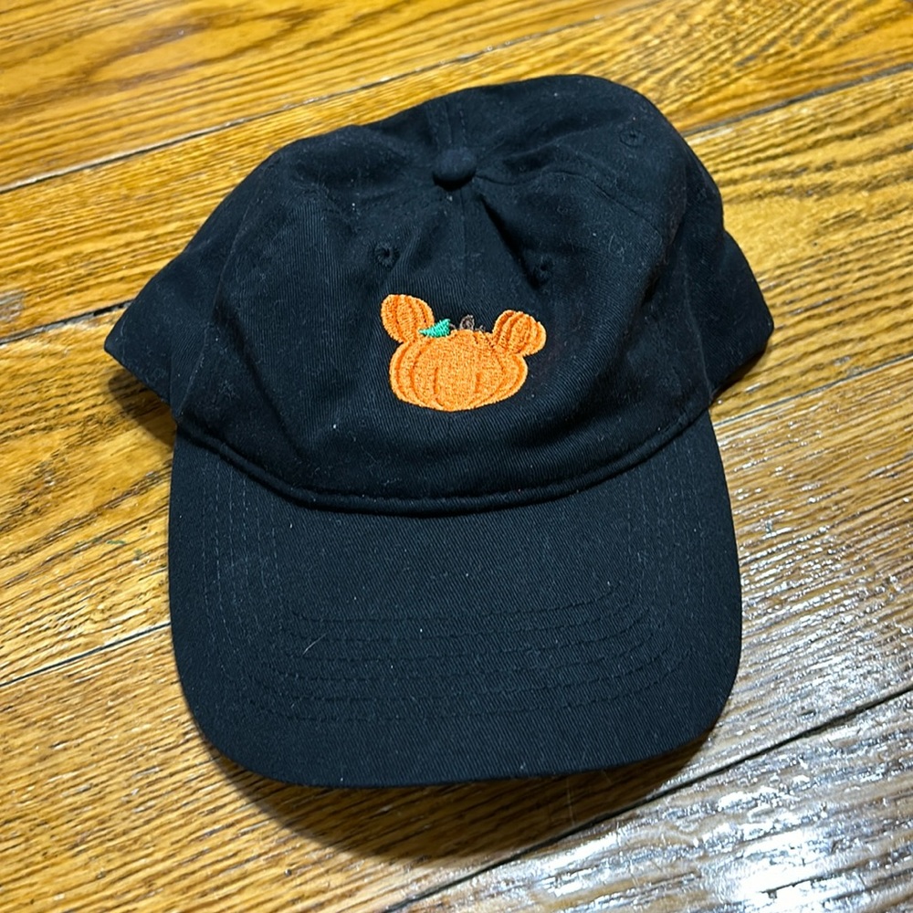 Black cap with pumpkin embroidery on front. One size.  Great condition.